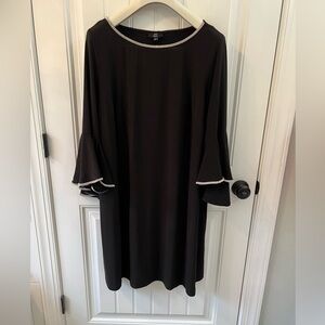 Black cocktail dress with flare sleeves and rhinestone trim